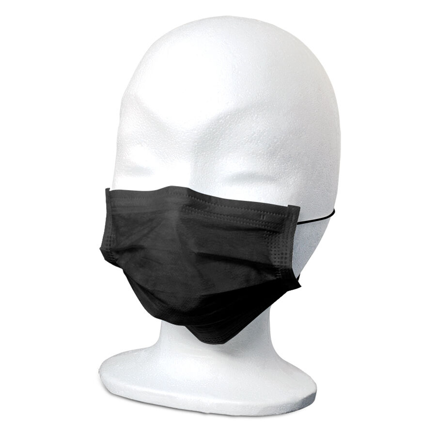 Masque facial noir confortable sur fond blanc Masque facial noir sur une tête de mannequin blanche en studio