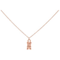 Collier ourson en gomme rose doré Collier rose doré avec pendentif ourson en gomme sur fond blanc