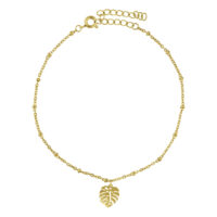 Bracelet de cheville doré avec pendentif Monstera sur fond blanc