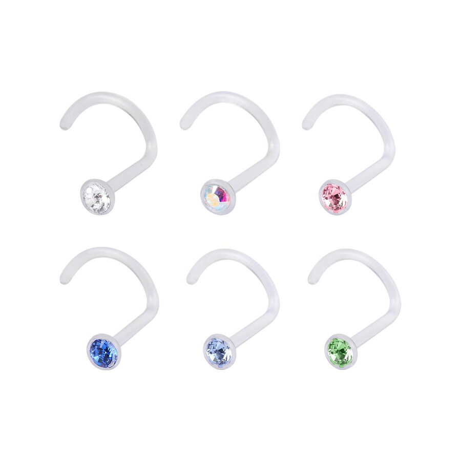 Piercing nasal en cristal coloré en bioplastique Six piercings nasaux en bioplastique avec des cristaux clairs, bleus et verts sur fond blanc