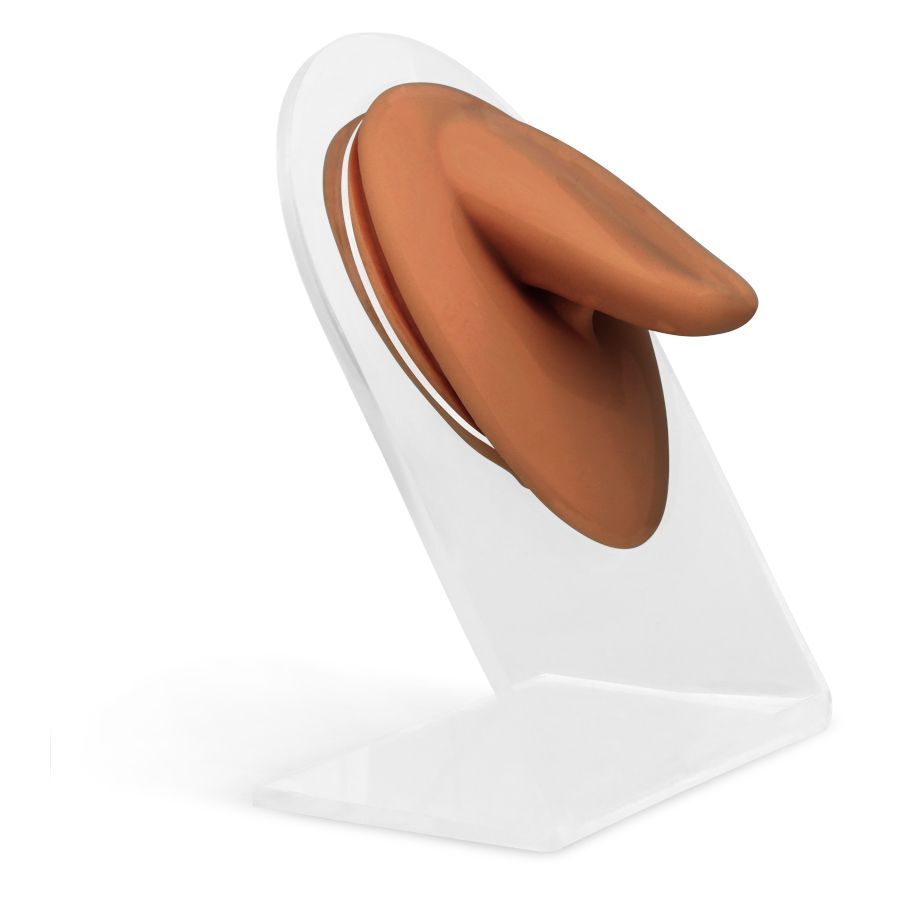 Body Bit Tongue - Embout en silicone marron Embout en silicone marron sur support transparent devant un fond blanc