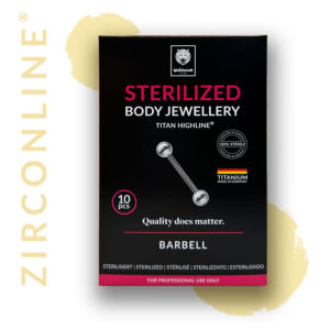Micro Barbell doré en titane sur fond noir, emballage visible