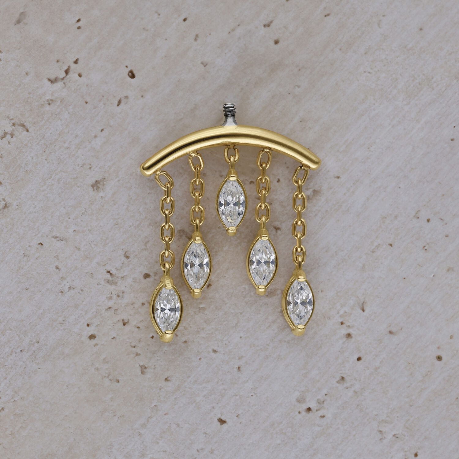 Embout Helix en or 18K avec gouttes de cristal Embout Helix doré avec gouttes de cristal claires sur fond beige