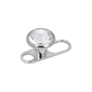 Ancrage dermal en titane argenté avec cristal transparent sur fond blanc