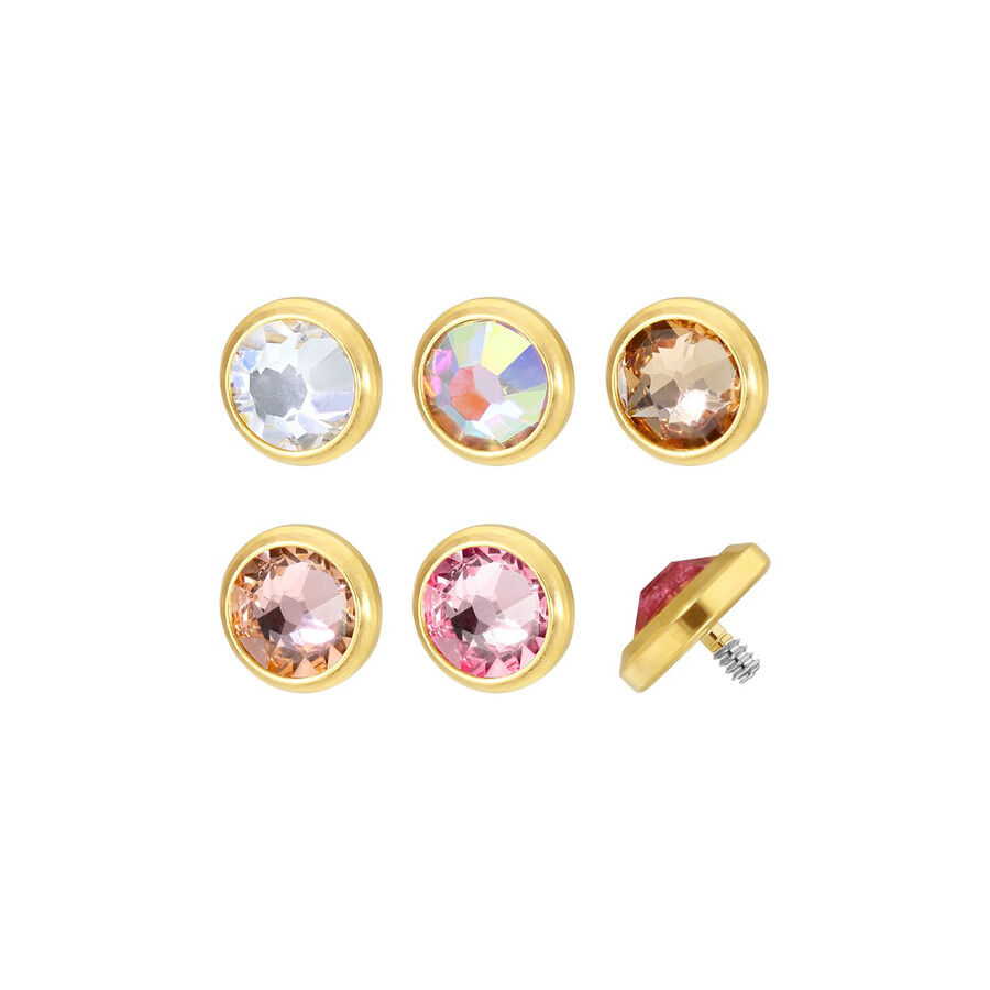 Cinq embouts de piercing en titane doré avec des cristaux clairs et colorés sur fond blanc