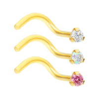 Clous de nez dorés avec cristaux Trois clous de nez dorés avec cristaux clairs, Aurora Boreale et roses sur fond blanc