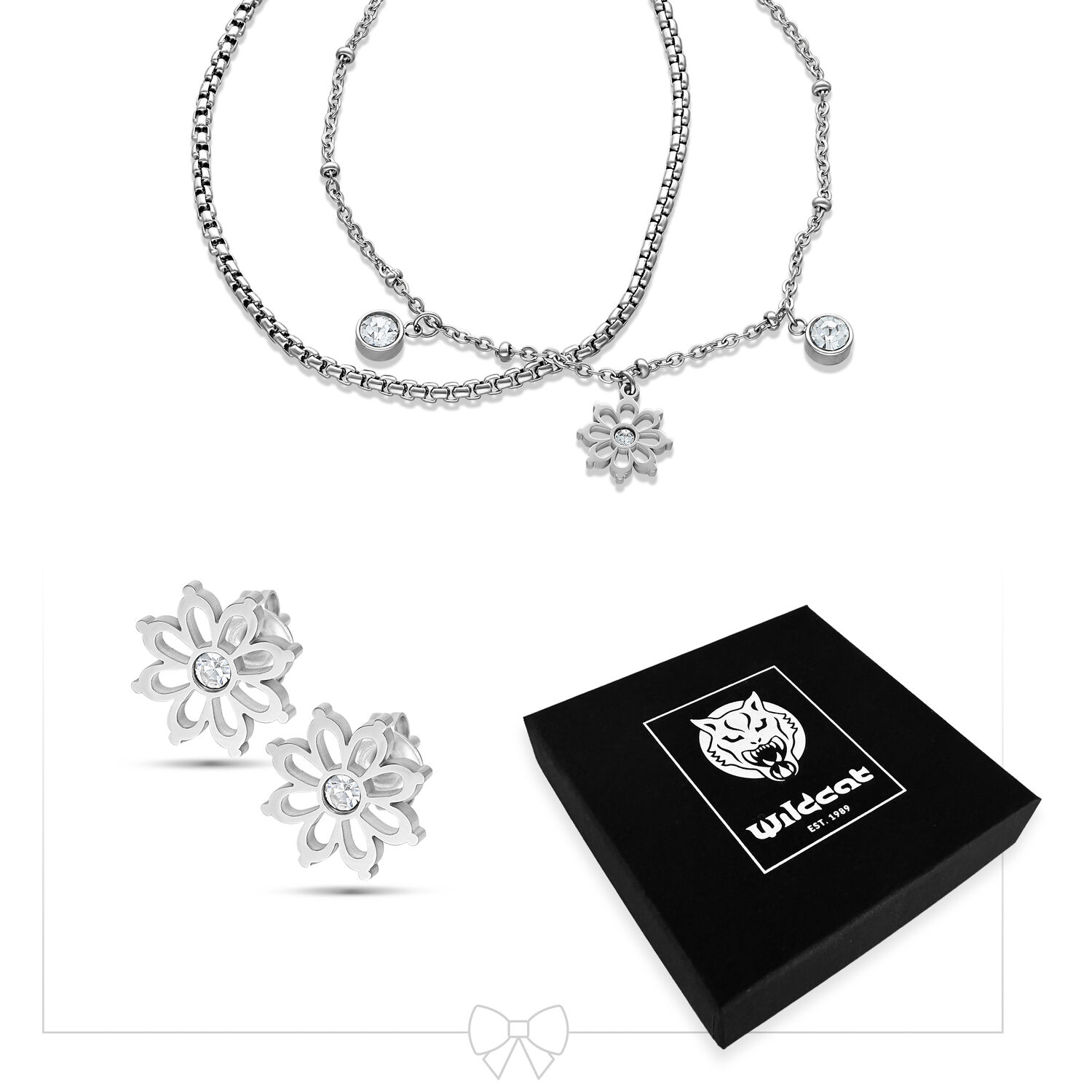 Set de bijoux Floralis argenté avec clous d'oreilles Collier et clous d'oreilles Floralis argentés devant une boîte Wildcat noire