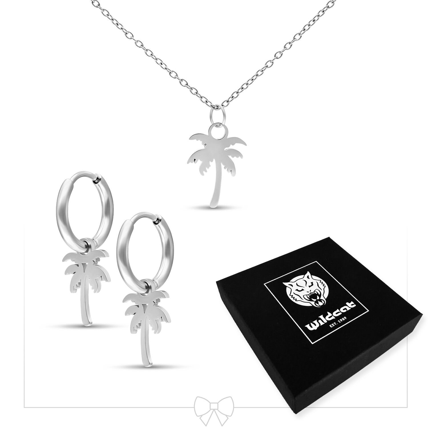 Collier et boucles d'oreilles palmiers en argent sur fond blanc avec emballage Wildcat