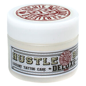 Hustle Butter Deluxe dans un pot blanc, 30 ml, sur fond neutre