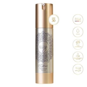 Flacon argenté de Radiance Balm avec bouchon doré et motif mandala