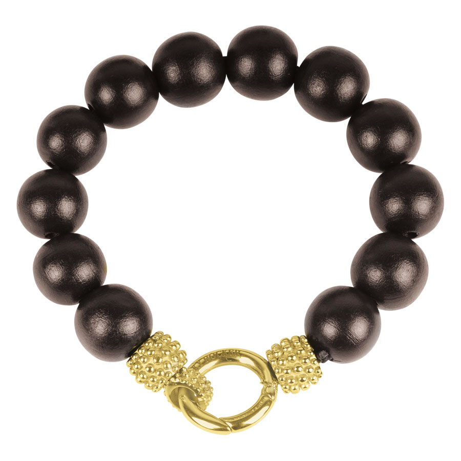Bracelet en or et ébène 'Little Mick' Unisexe Bracelet avec perles d'ébène noires et détails dorés sur fond blanc