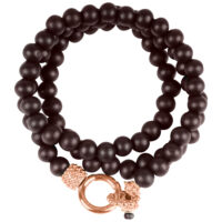 Bracelet en bois noir 'Petit Prince' 190mm Bracelet en bois noir 'Petit Prince' avec fermoir en or rose sur fond blanc