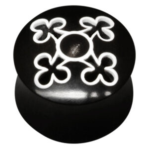 Tunnel en corne noire avec motif blanc en forme de croix sur fond noir