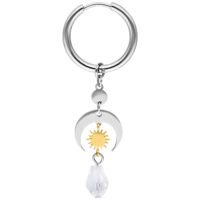 Créoles Celestial Light en argent et or Créoles argentées et dorées avec pendentif en cristal sur fond blanc