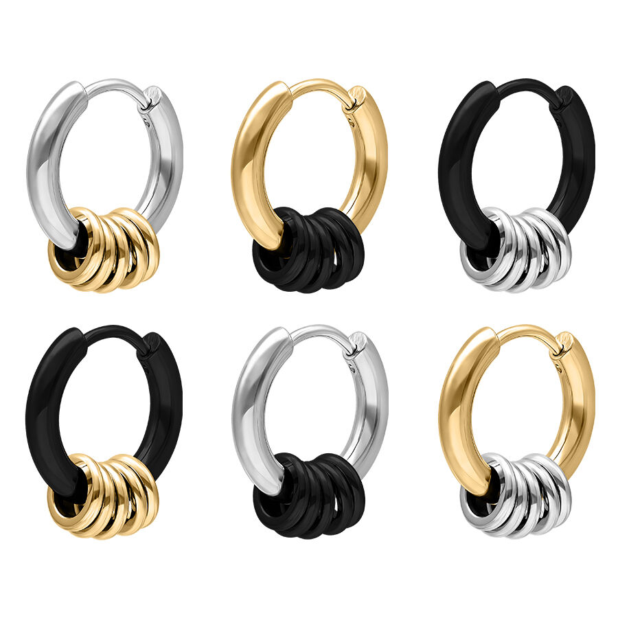 Ensemble de 5 petites bagues en noir, argent, or Six petites boucles d'oreilles en noir, argent et or sur fond blanc