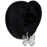 Boucles d'oreilles papillon élégantes en acier inoxydable Boucles d'oreilles papillon en argent sur présentoir noir, cristal clair