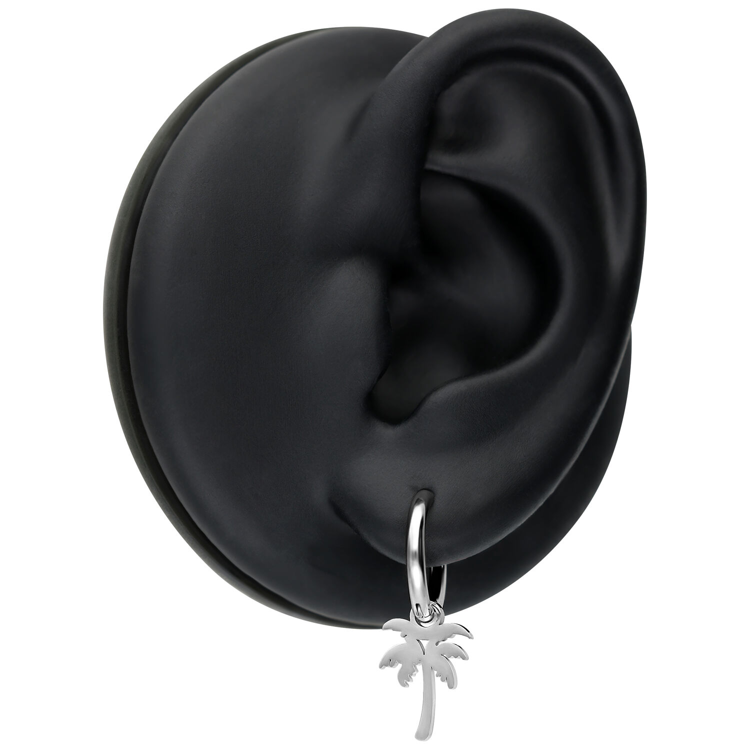 Boucles d'oreilles argentées avec pendentif palmier sur présentoir noir