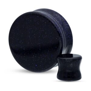 Plug rond en pierre noire avec effet scintillant sur fond blanc