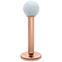 Labret en opale blanc avec placage or rose Labret avec opale synthétique blanche et tige en titane plaqué or rose sur fond blanc