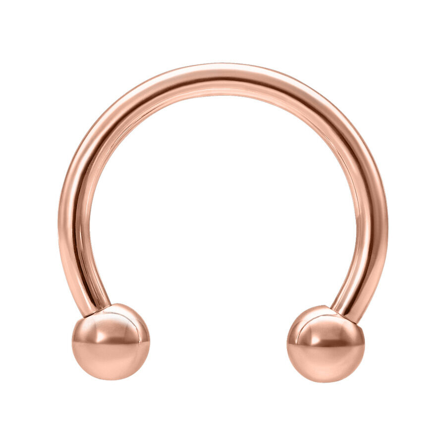 Barbell circulaire en acier chirurgical rosé Barbell circulaire en acier chirurgical rosé sur fond blanc