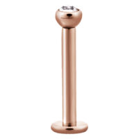 Labret en or rose avec cristal Labret en or rose en acier chirurgical avec cristal clair sur fond blanc
