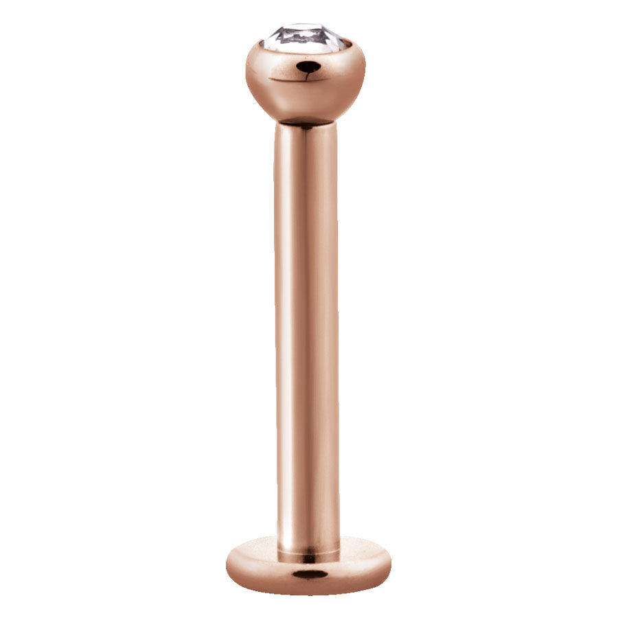 Labret en or rose avec cristal Labret en or rose en acier chirurgical avec cristal clair sur fond blanc
