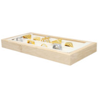 Présentoir à bagues noir de Wildcat Présentoir rectangulaire en bois avec des bagues noires sur fond beige