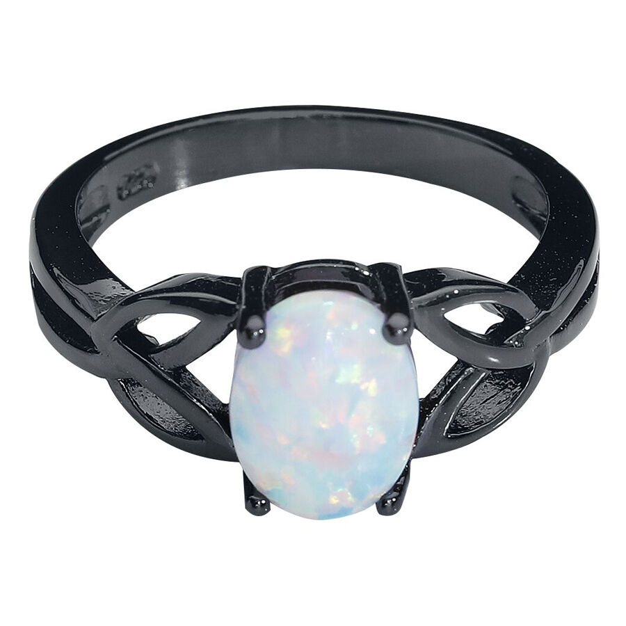 Bague en pierre de lune en acier chirurgical noir Bague noire en acier chirurgical avec opale blanche sur fond neutre