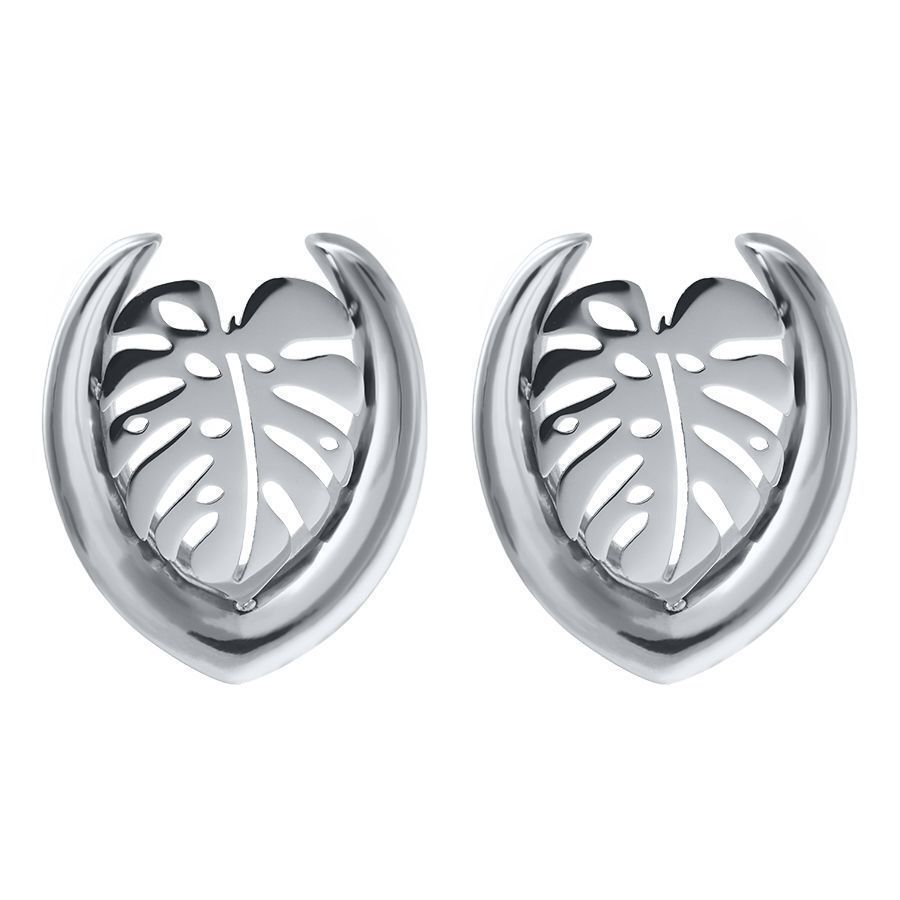 Ear Saddles argentés avec design Monstera sur fond blanc