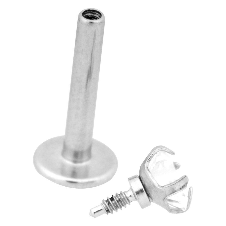 Labret argenté avec pointe en forme d'étoile cristalline Labret argenté en acier chirurgical avec pointe étoile transparente sur fond blanc
