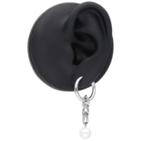 Boucles d'oreilles en perles rose doré en set Boucles d'oreilles rose doré avec pendentif en perles sur fond noir