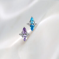 Embout Push Fit Crystal Harmony Lavande & Turquoise Deux embouts Push Fit en titane lavande et turquoise sur fond blanc