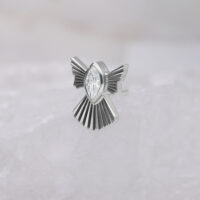 Embout Push Fit argenté en forme de flocon de neige avec cristal clair sur fond clair