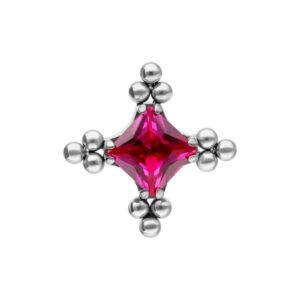 Embout argenté avec cristal rouge rubis et motif à bulles sur fond blanc