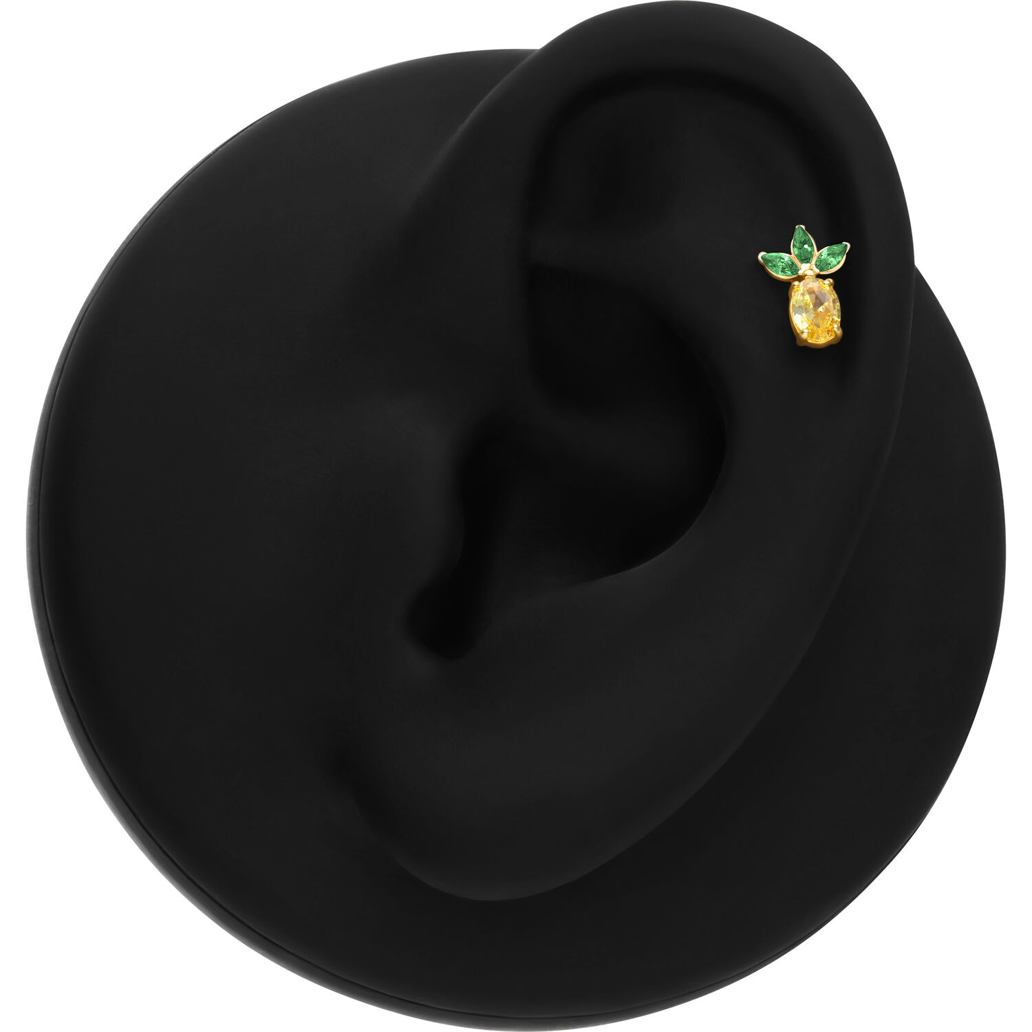 Embout de piercing ananas doré Embout ananas doré avec feuilles vertes sur présentoir noir