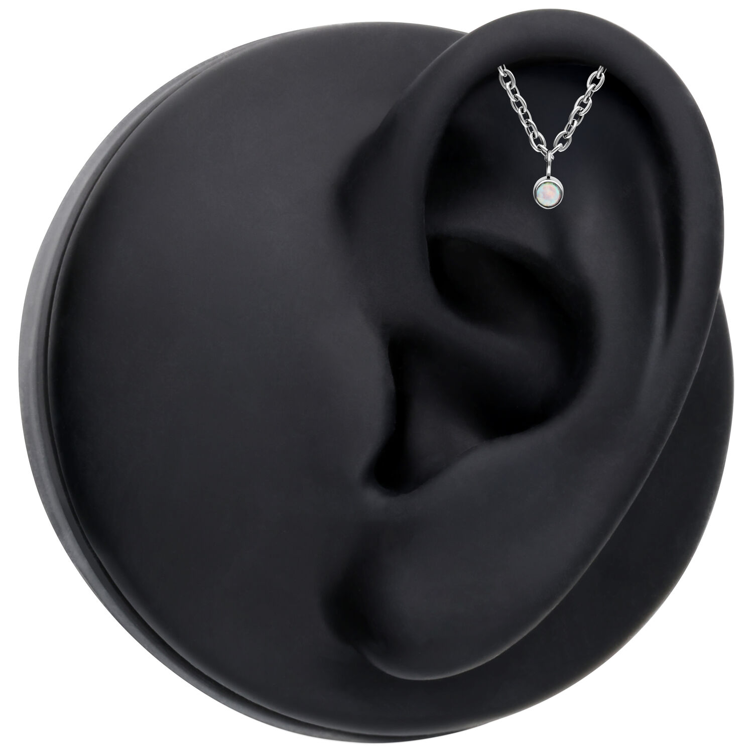 Embout Push Fit argenté avec opale synthétique sur modèle d'oreille noir