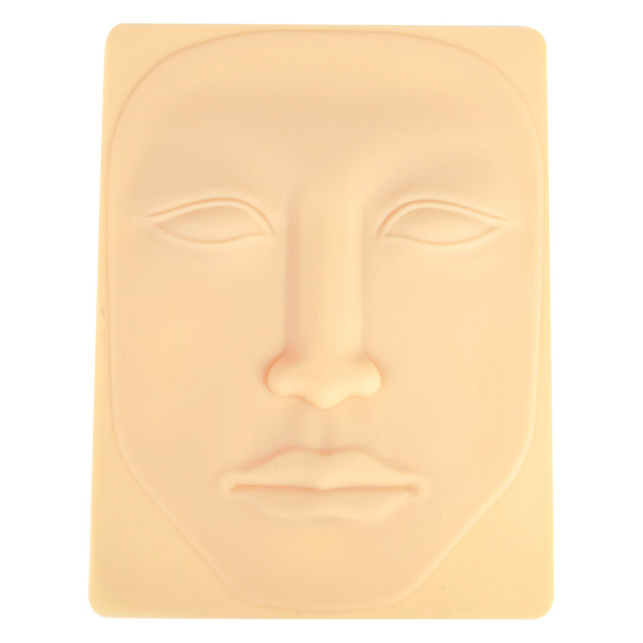 Peau de tatouage visage beige en silicone Peau de tatouage en silicone beige en forme de visage sur fond clair