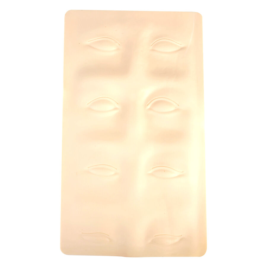 Peau d'entraînement en silicone beige pour sourcils Plaque en silicone beige avec contours de sourcils sur fond blanc