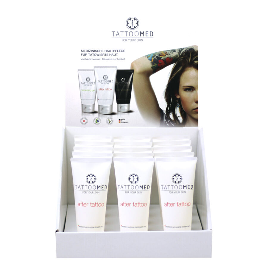 TattooMed® après-tatouage 25 ml Présentoir TattooMed® après-tatouage 25 ml Tubes dans un présentoir blanc avec modèle en arrière-plan