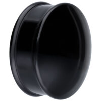 Plug noir en PMMA pour piercing d'oreille Plug rond noir en PMMA sur fond blanc