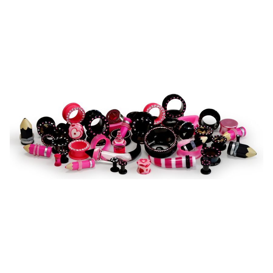 Set de piercings rose et noir de Wildcat Différents piercings roses et noirs répartis sur un fond blanc