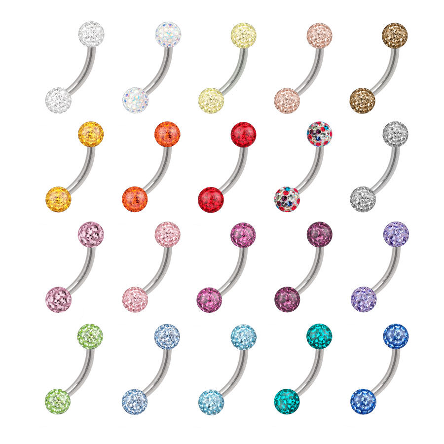 Bananabells en titane colorés avec cristaux Différents Bananabells colorés en titane avec cristaux sur fond blanc
