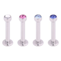 Labret avec cristal en argent et bleu Quatre labrets argentés avec des cristaux clairs, roses et bleus sur fond blanc